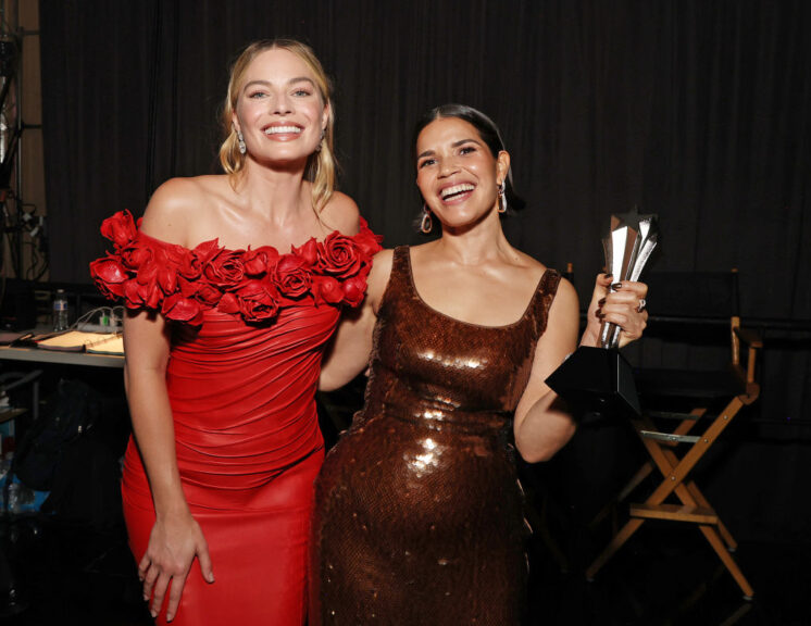 SANTA MONICA, CALIFORNIA - JANUARY 14: (L-R) Margot Robbie and America Ferrera, winner of the eighth annual SeeHer Award Award, pose backstage during the 29th Annual Critics Choice Awards at Barker Hangar on January 14, 2024 in Santa Monica, California. (Photo by Kevin Mazur/Getty Images for Critics Choice Association)