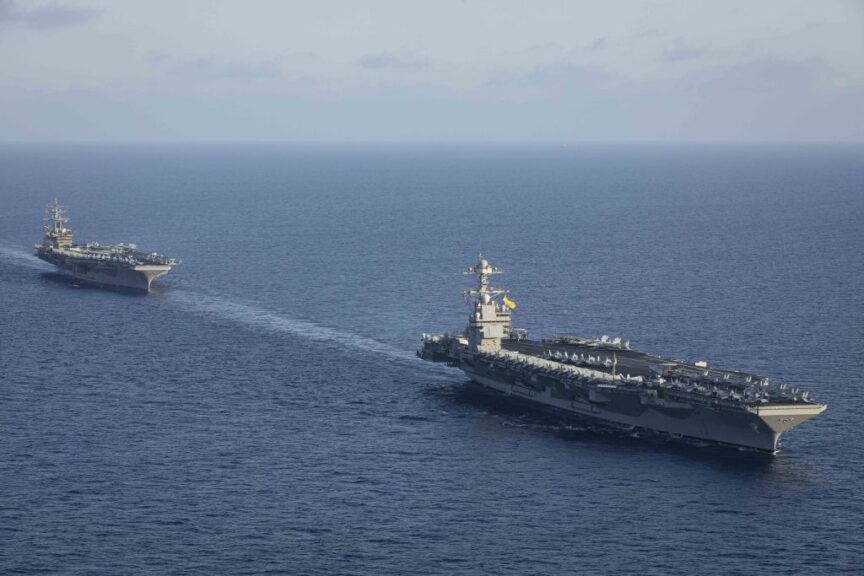 AT SEA - NOVEMBER 03: (----EDITORIAL USE ONLY - MANDATORY CREDIT - 'UNITED STATES NAVY / MALACHI LAKEY / HANDOUT' - NO MARKETING NO ADVERTISING CAMPAIGNS - DISTRIBUTED AS A SERVICE TO CLIENTS----) An aerial view of aircraft carriers of the United States Navy USS Gerald R. Ford and USS Dwight D. Eisenhower together in eastern Mediterranean on November 03, 2023.