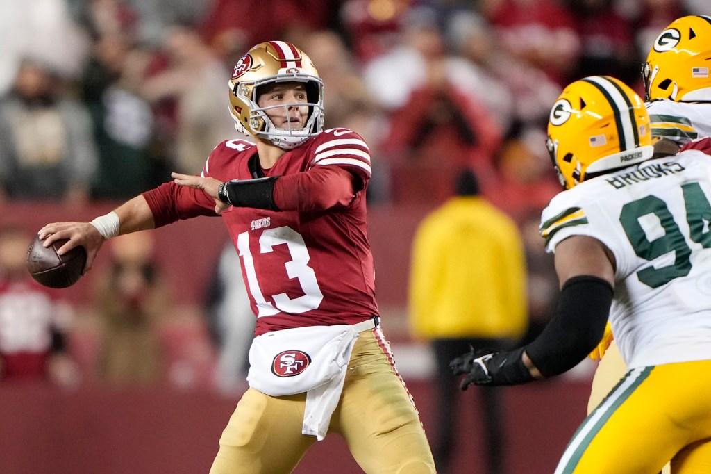 Brock Purdy looks to pass during the 49ers' NFC divisional round win over the Packers.