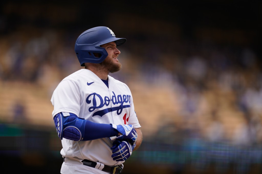 Dodgers' Max Muncy reacts after being intentionally walked during the eighth inning