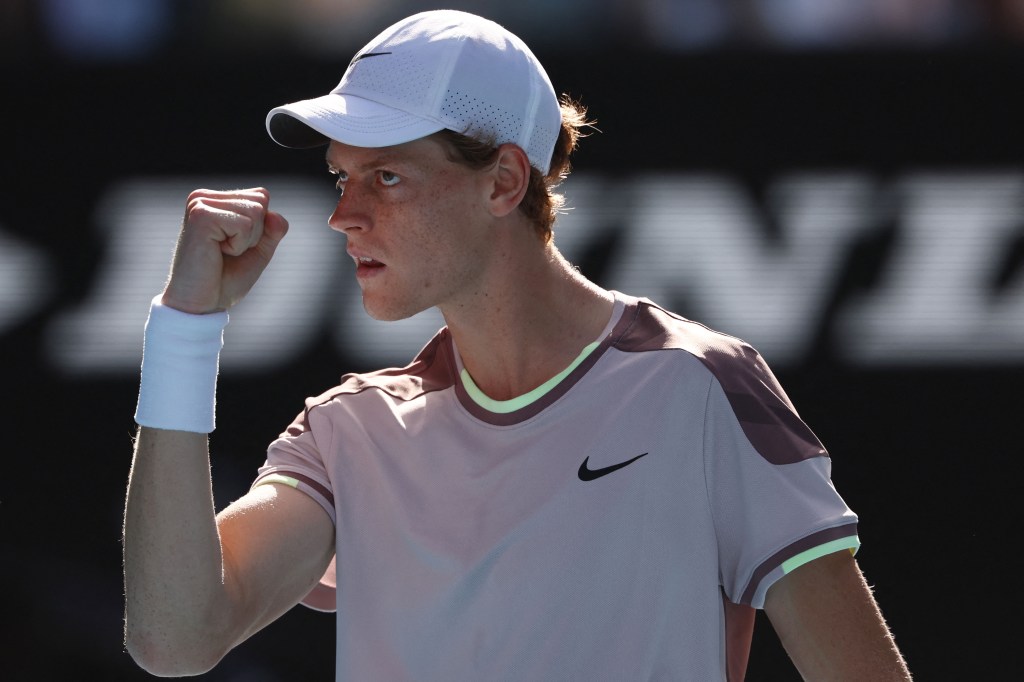 Jannik Sinner celebrates during his four-set victory over Novak Djokovic in the Australian Open semifinals.