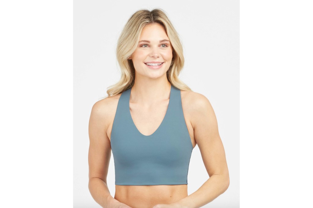 A woman in a light blue sports bra 