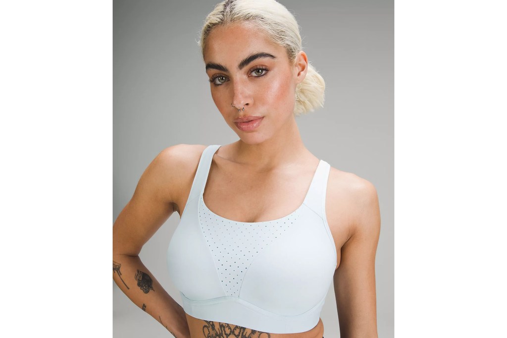 model wearing white high scoopneck sports bra