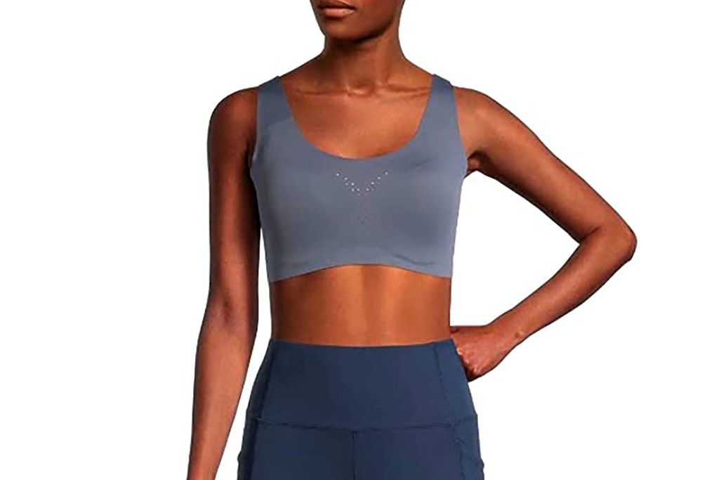 A woman in a gray sports bra 