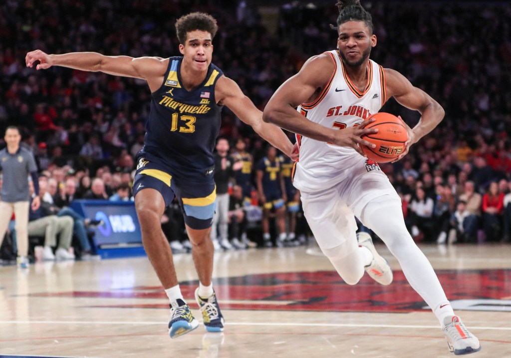 Zuby Ejiofo looks to drive past Marquette's Oso Ighodaro during a recent game.