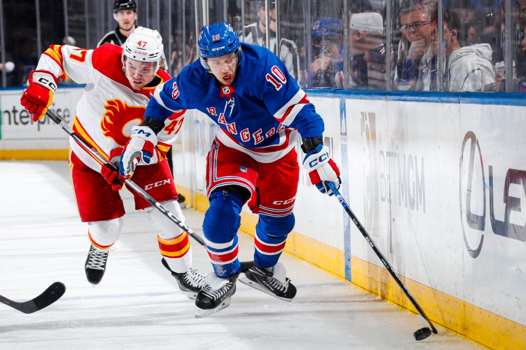 Artemi Panarin skates the puck up the ice against the Flames on Monday.