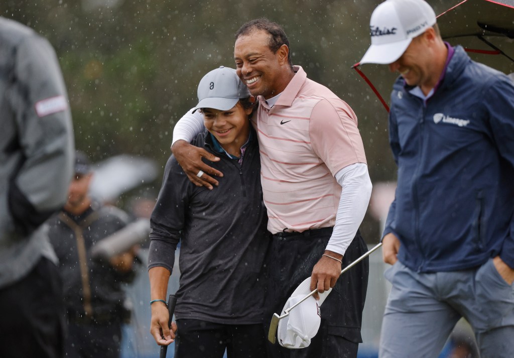 Tiger Woods hugs his son Charlie during the PNC Championship on Dec. 16, 2023.