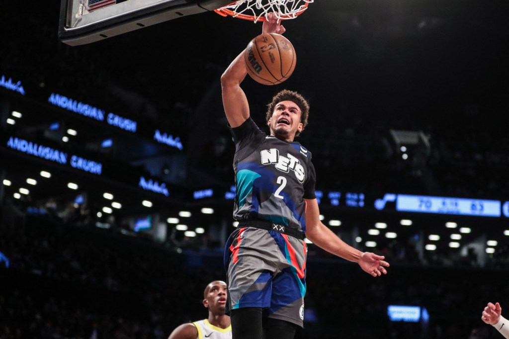 Cam Johnson, who is nearing his return to the Nets' lineup, slams home a dunk during a game against the Jazz in January.