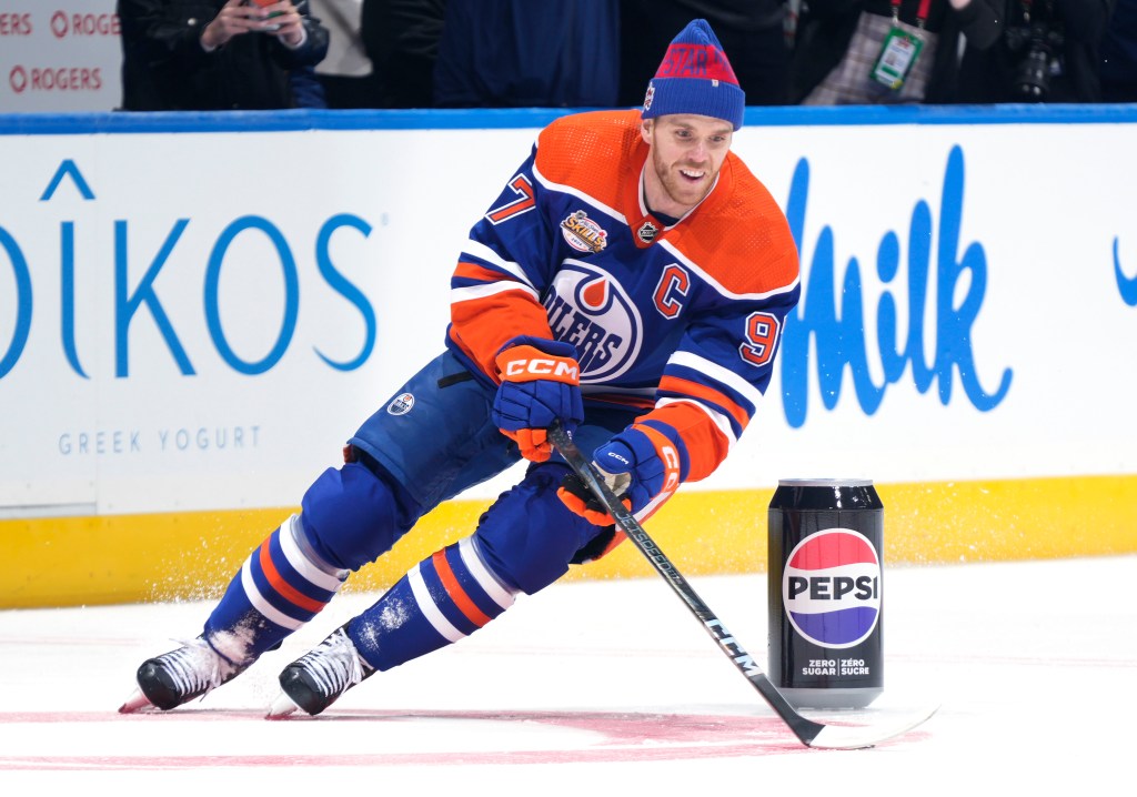 Connor McDavid, smiling while performing in one of the events, captured the NHL All-Star Skills competition.