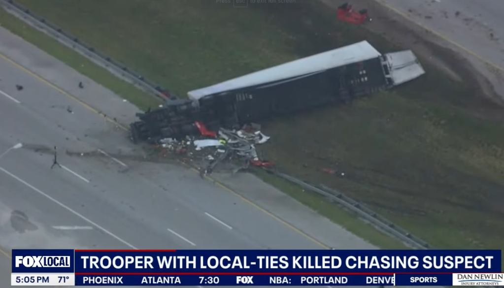 Debris from the crash involving Fink's car and a tractor-trailer lie on the side of Interstate 95 on Feb 2, 2024 in Florida.