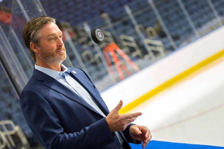 Patrick Roy of the Quebec Remparts tosses a puck to himself on the bench.