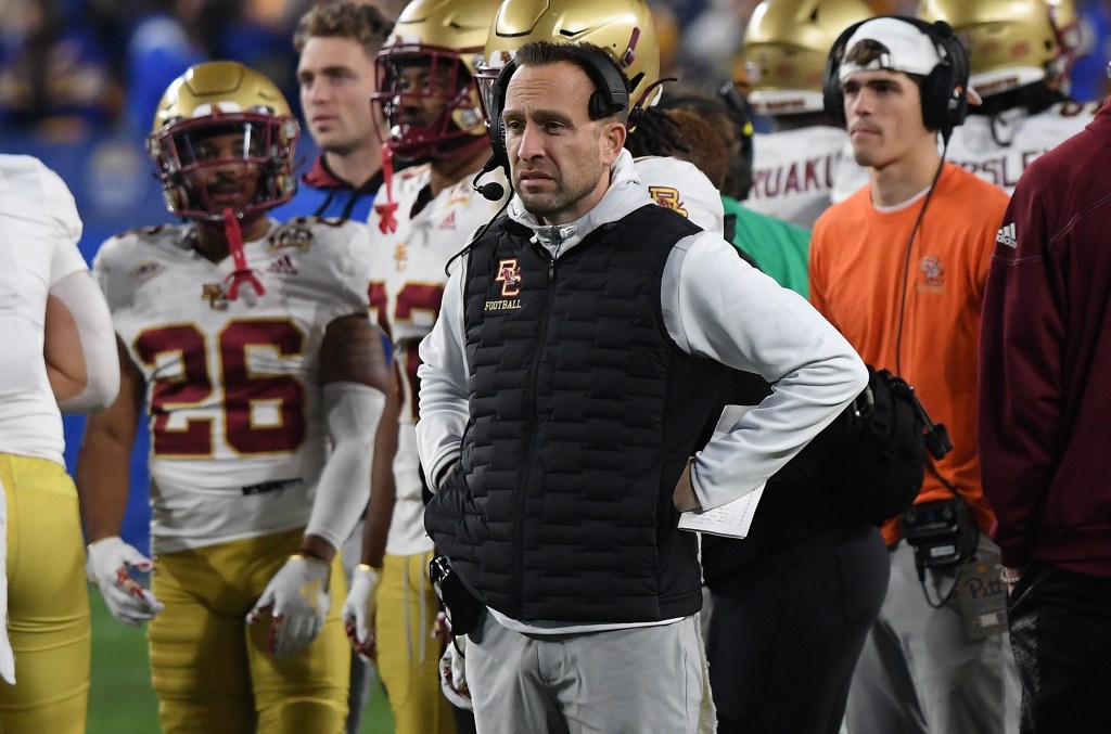 Head coach Jeff Hafley of Boston College watches a game replay on the video board at Acrisure Stadium in Pittsburgh, Pennsylvania.