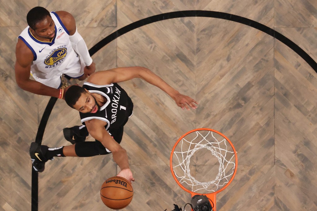 The Nets' Mikal Bridges skies to the basket during Monday's game against the Warriors.