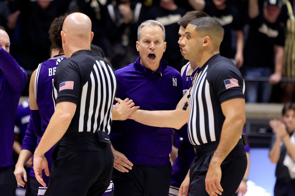 Head coach Chris Collins of the Northwestern Wildcats reacts after receiving a technical foul during the second half against the Purdue Boilermakers at Mackey Arena on Jan. 31, 2024. 