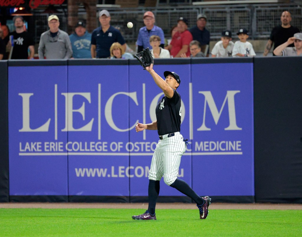 Giancarlo Stanton catching a fly ball hit by Miami Marlins third baseman Jon Berti #5, in the second inning.