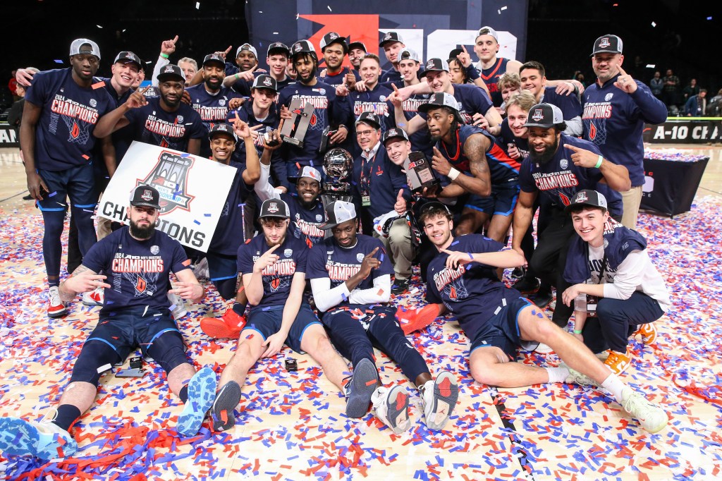 The Duquesne Dukes celebrate after defeating the Virginia Commonwealth Rams 57-51 to win the Atlantic 10 Tournament Championship at Barclays Center. 