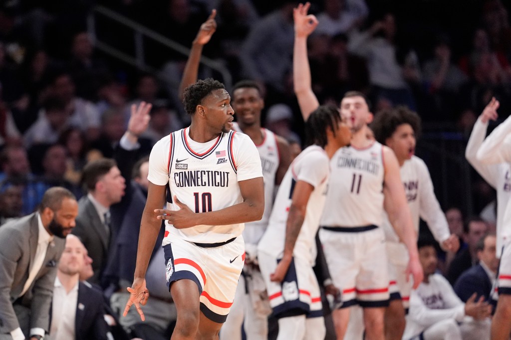 UConn guard Hassan Diarra (10) reacts after scoring a 3-point basket against St. John's during the second half of an NCAA college basketball game in the semifinals of the Big East men's tournament.