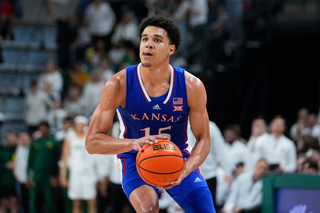   Kevin McCullar Jr. #15 of the Kansas Jayhawks reacts after drawing a foul during the 2nd half of the game against the Kansas State Wildcats at Allen Fieldhouse on March 05, 2024.