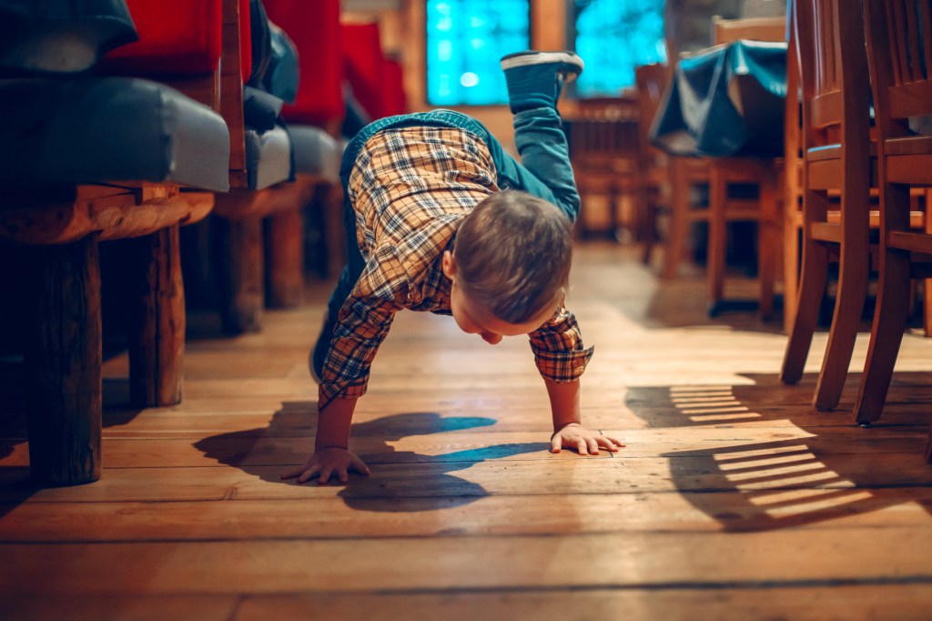 misbehaving child on restaurant floor