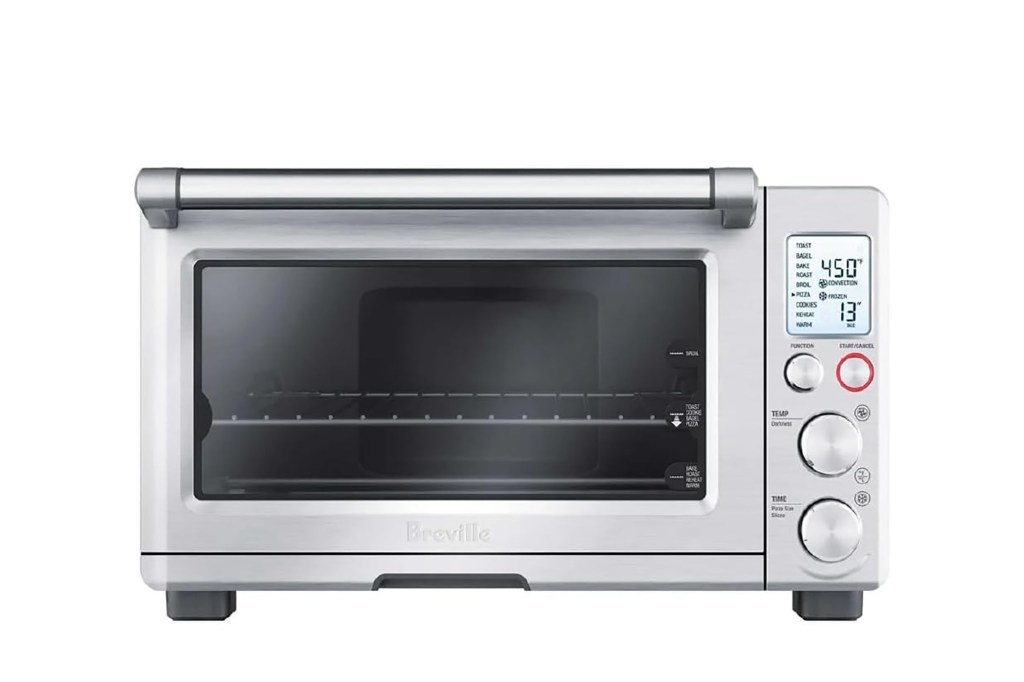 a silver toaster oven with buttons and dials