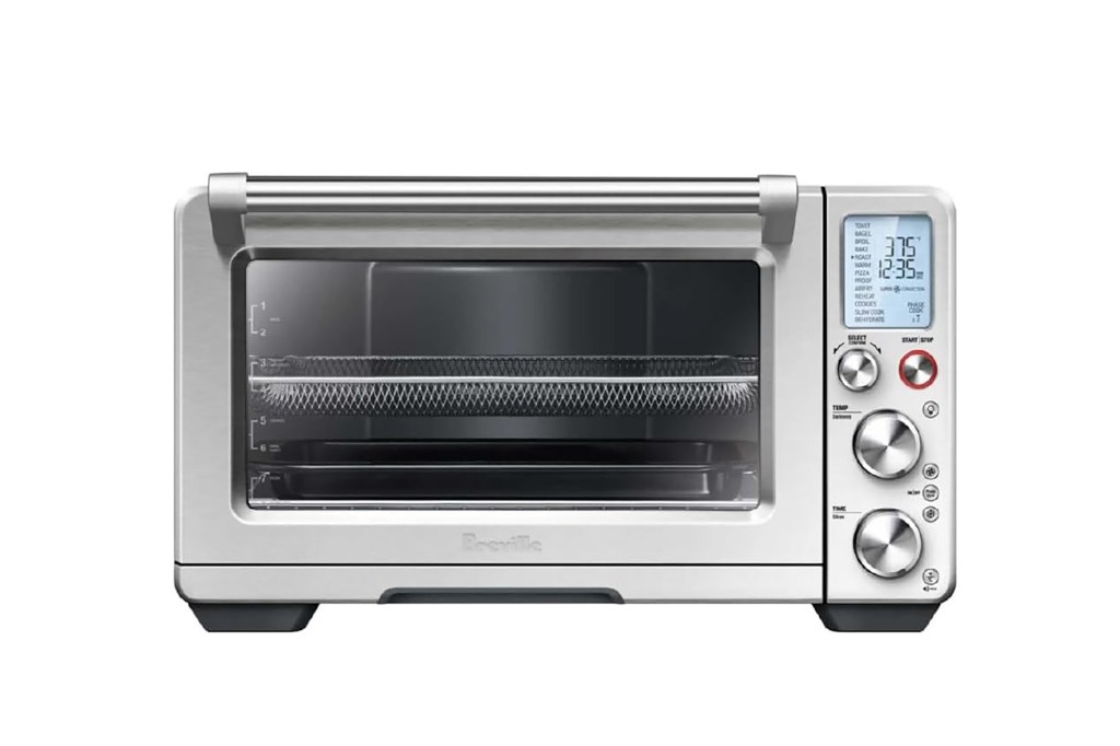 a silver toaster oven with a display.