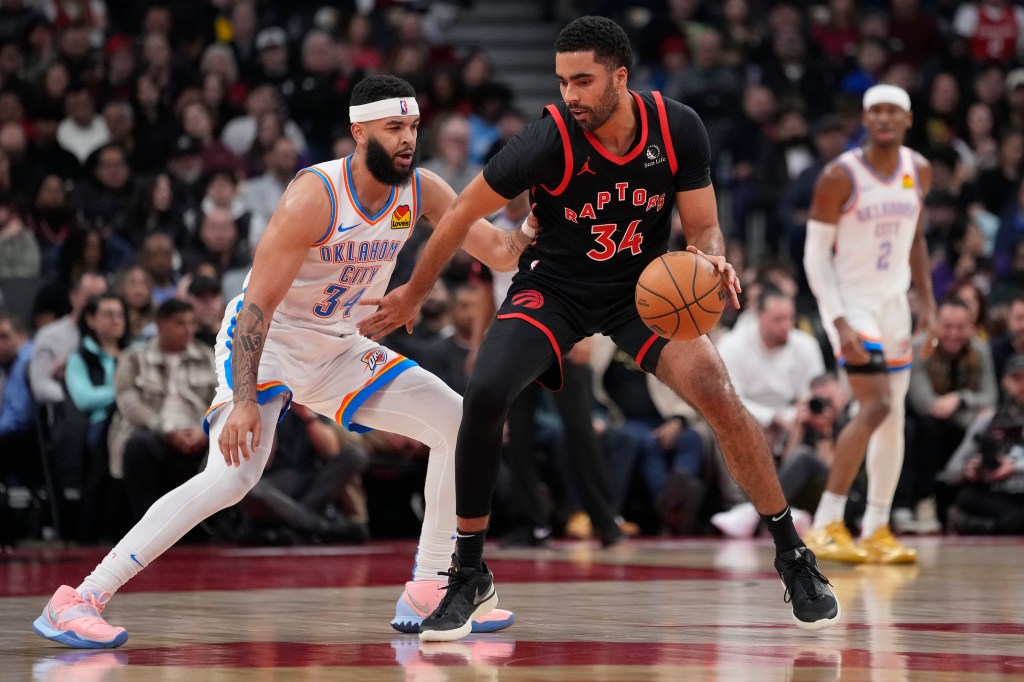 Toronto Raptors forward Jontay Porter (34) controls the ball against Oklahoma City Thunder forward Kenrich Williams (34) during the first half at Scotiabank Arena. 