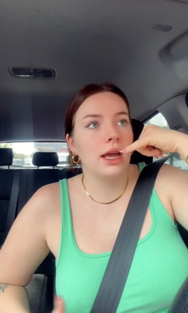 Young Aussie creator Hannah Elliot speaking in a car about employees being replaceable in an online skit