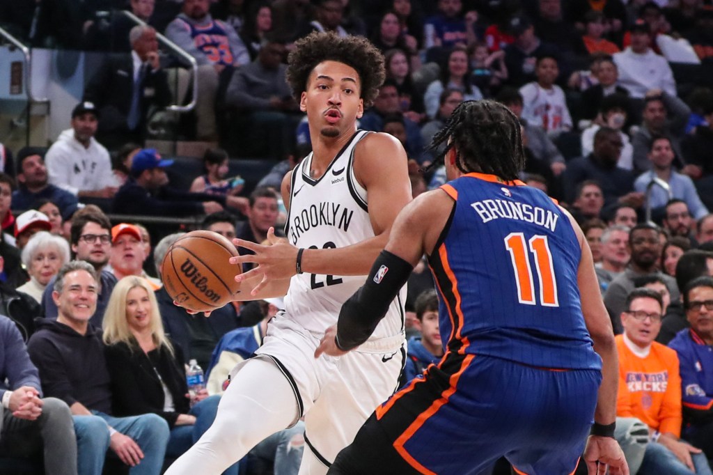 Nets forward Jalen Wilson looks to drive past Knicks guard Jalen Brunson.