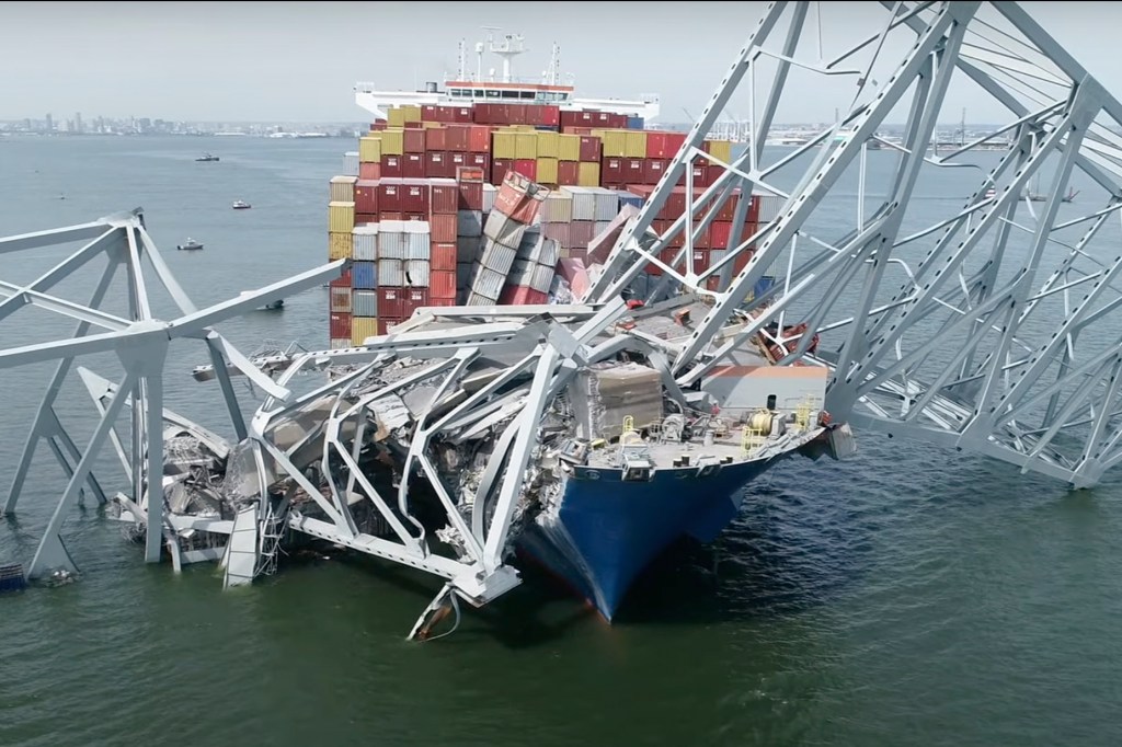 The cargo ship Dali is seen stuck under part of the structure of the Francis Scott Key Bridge after the ship hit the bridge on March 26, 2024, in Baltimore.