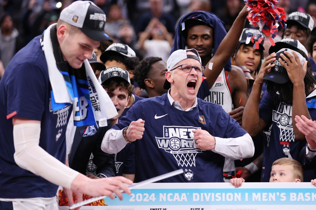 Head coach Dan Hurley of the Connecticut Huskies celebrates after defeating the Illinois Fighting Illini in the Elite 8 round of the NCAA Men's Basketball Tournament at TD Garden on March 30, 2024 in Boston