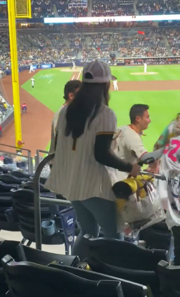 Giants fan shoves a Padres fan after she slapped him across the face during a heated argument at Petco Park on Saturday.