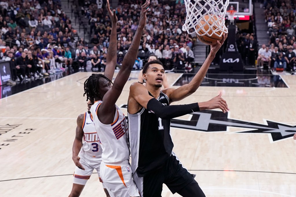 Victor Wembanyama is guarded by Bol Bol during the Phoenix Suns 131-106 victory over the San Antonio Spurs on Saturday, March 23. 