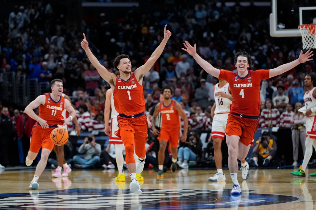 Clemson guard Chase Hunter (1) guard Joseph Girard III (11) and forward Ian Schieffelin (4) celebrate after a win over Arizona in a Sweet 16 college basketball game in the NCAA tournament Thursday, March 28, 2024, in Los Angeles. 