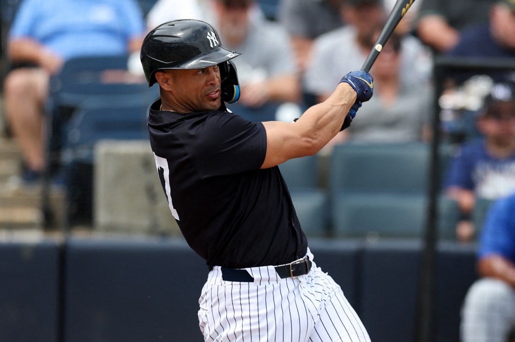  New York Yankees right fielder Giancarlo Stanton (27) hits a two-run home run against the Toronto Blue Jays in the third inning at George M. Steinbrenner Field. 