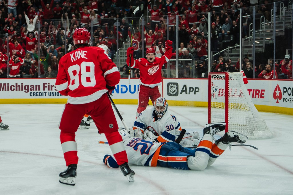 Patrick Kane #88 of the Detroit Red Wings shoots and scores against goalie Ilya Sorokin #30 of the New York Islanders during the third period at Little Caesars Arena.