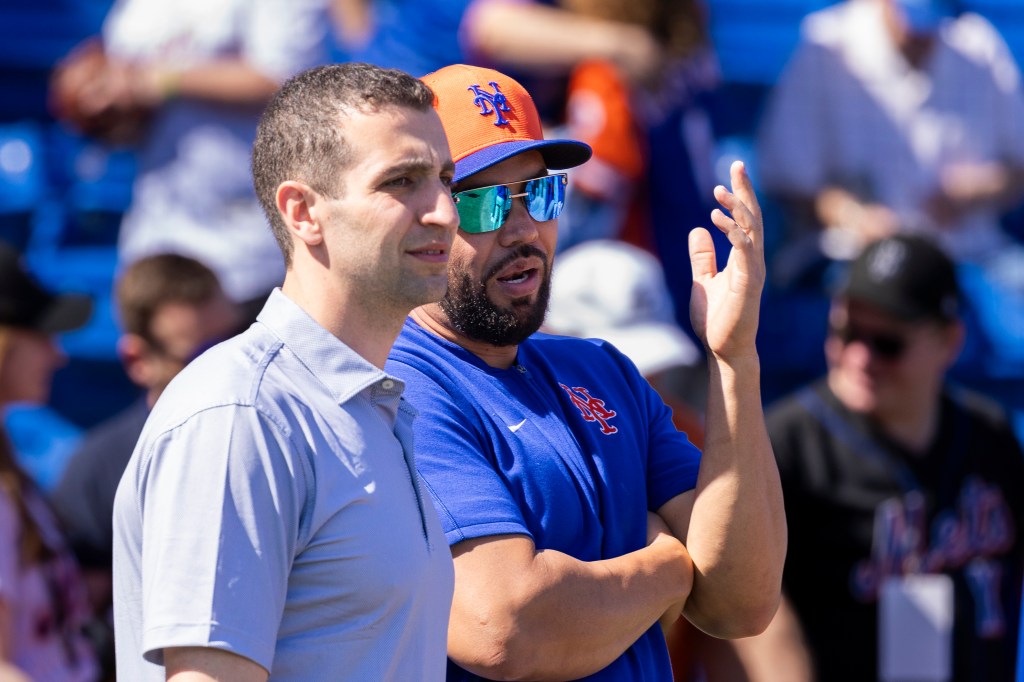 Mets president of baseball operations David Stearns, left, speaks with Carlos Beltran, Special Assistant to the President of Baseball Operations