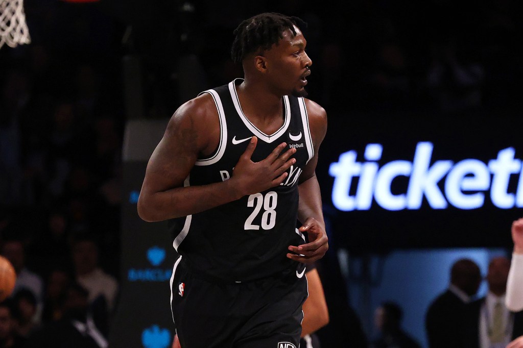 Nets forward Noah Clowney heads down the court after a 3-pointer against the Grizzlies.