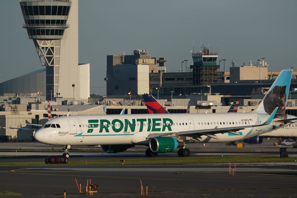 A Frontier Airlines flight taxis before takeoff from Philadelphia International Airport.