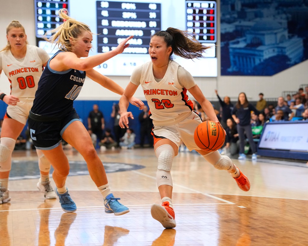 Princeton Tigers Guard Kaitlyn Chen (20) dribbles the ball against Columbia Lions Guard Kitty Henderson (10) during the second half of the Women's Ivy League League Basketball Championship game.