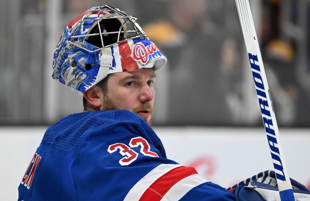 Jonathan Quick takes a breather during a stoppage in play during the Rangers' 5-2 win over the Bruins.