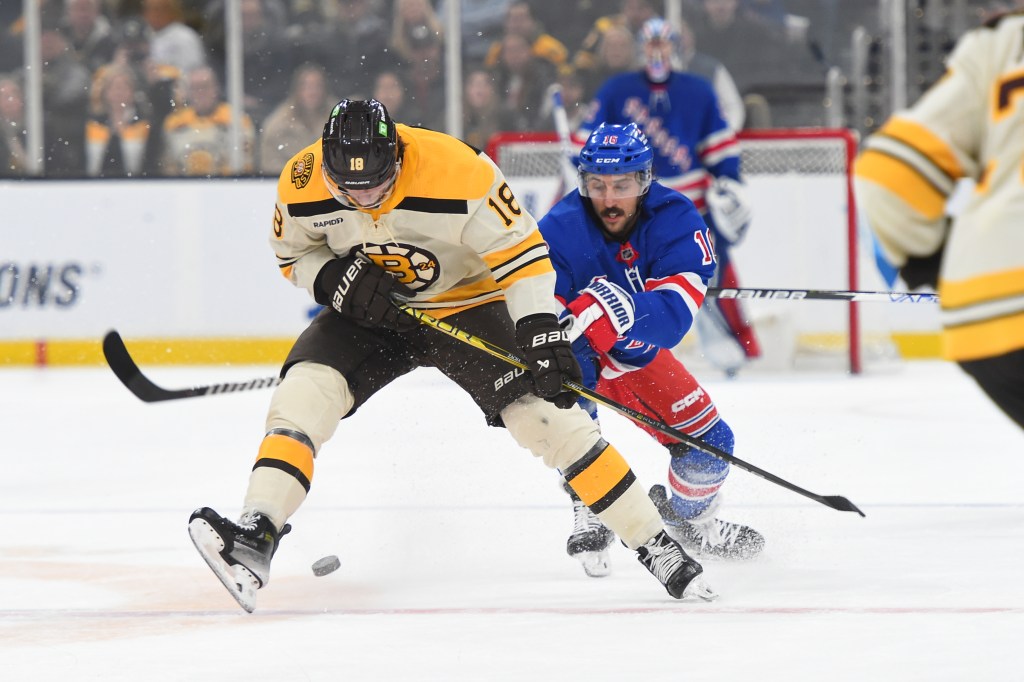 Pavel Zacha #18 of the Boston Bruins skates against Vincent Trocheck #16 of the New York Rangers at the TD Garden on March 21, 2024.