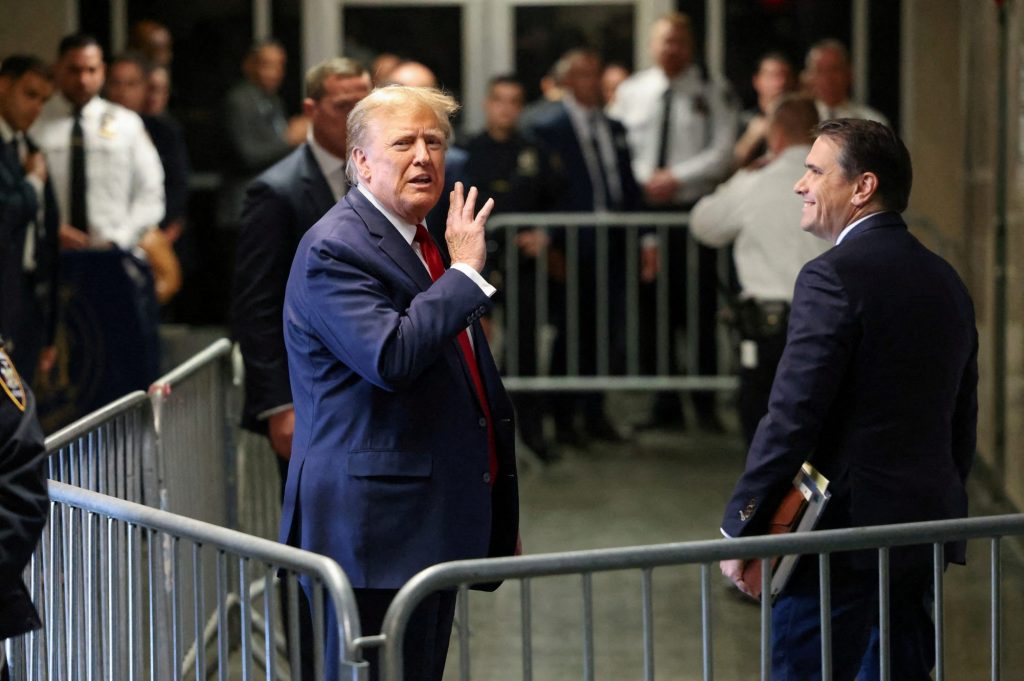 Former U.S. President Donald Trump gestures outside the courtroom in New York State Supreme Court in New York City, U.S., February 15, 2024.