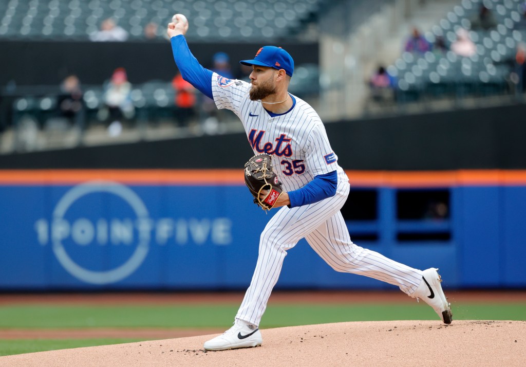 Adrian Houser throws a pitch in the first inning of the Mets' Game 1, 11-inning loss.