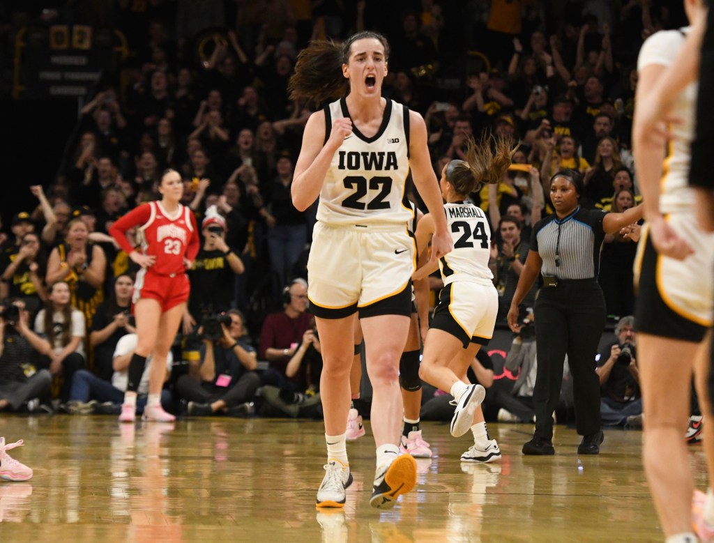 Caitlin Clark celebrates after breaking Pete Maravich's all-time NCAA scoring record on March 3, 2024.