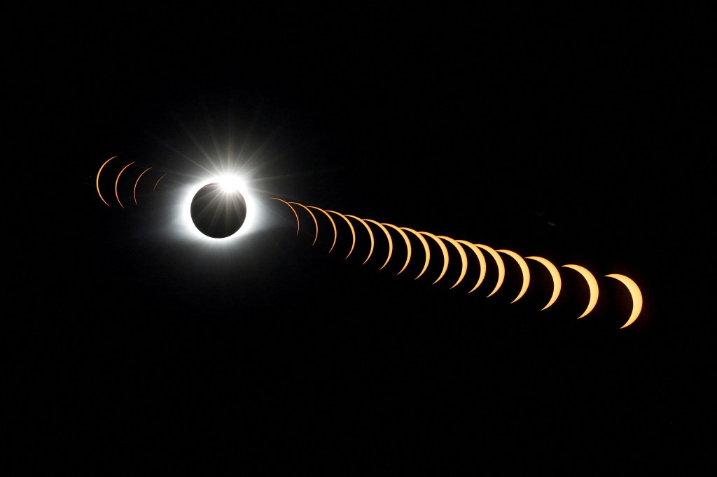 FILE PHOTO: A composite image of 21 separate photographs taken with a single fixed camera shows the solar eclipse as it creates the effect of a diamond ring at totality as seen from Clingmans Dome, which at 6,643 feet (2,025m) is the highest point in the Great Smoky Mountains National Park, Tennessee, U.S. August 21, 2017. REUTERS/Jonathan Ernst/File Photo