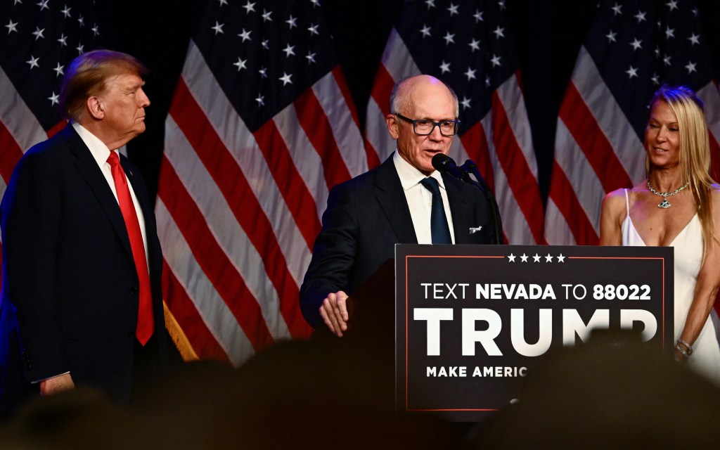 Jets owner Woody Johnson speaks as his wife Suzanne and former US President and 2024 presidential hopeful Donald Trump listen during a Caucus Night watch party in Las Vegas, Nevada, on February 8, 2024.