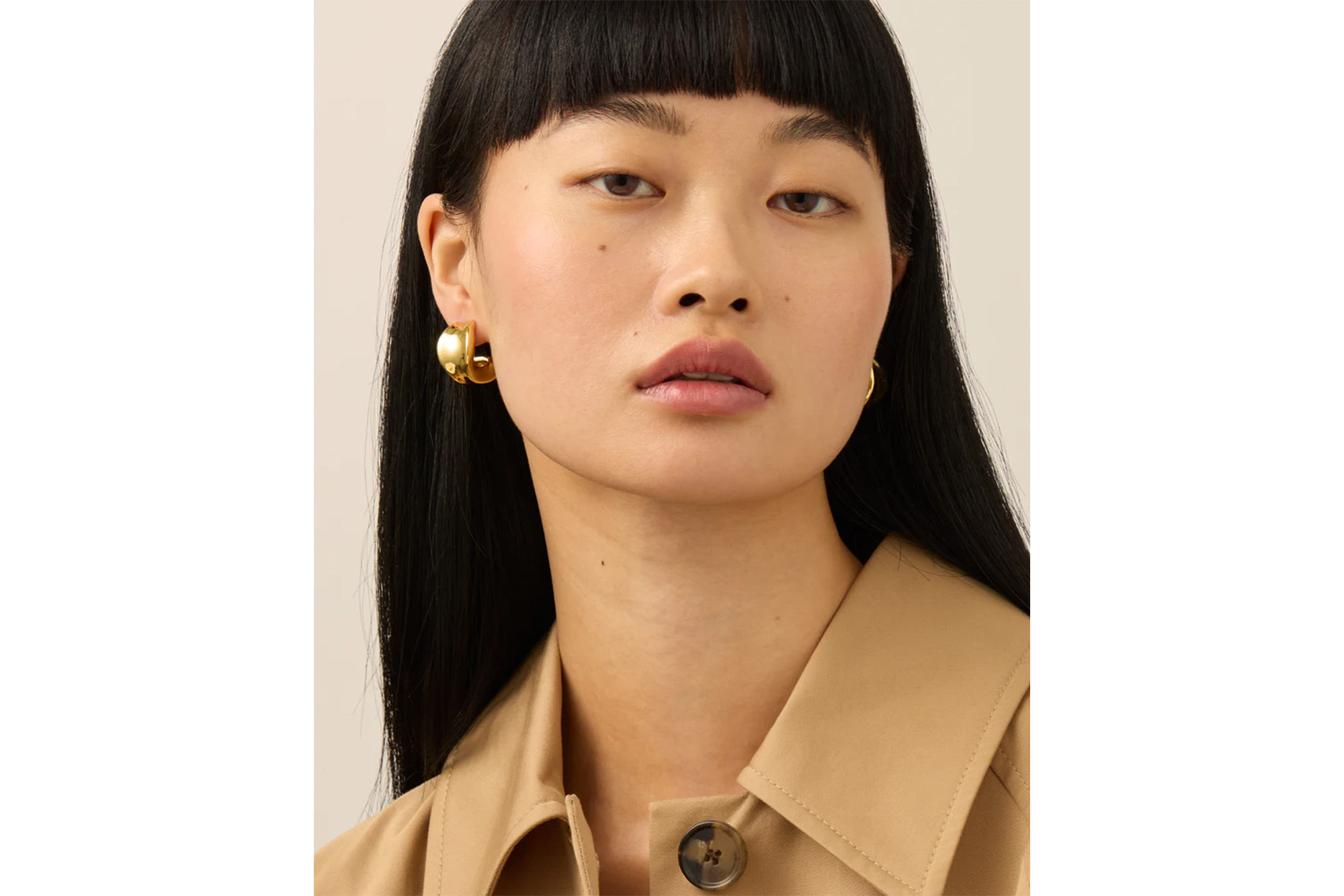 A model in chunky gold hoops