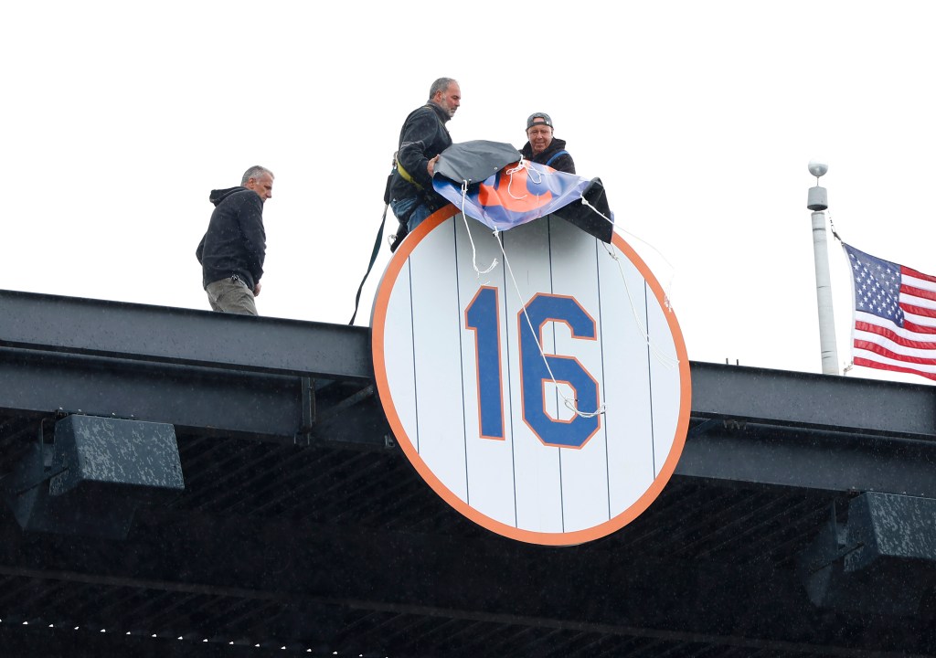 Dwight Gooden's No. 16 is revealed at the top of Citi Field on Sunday.