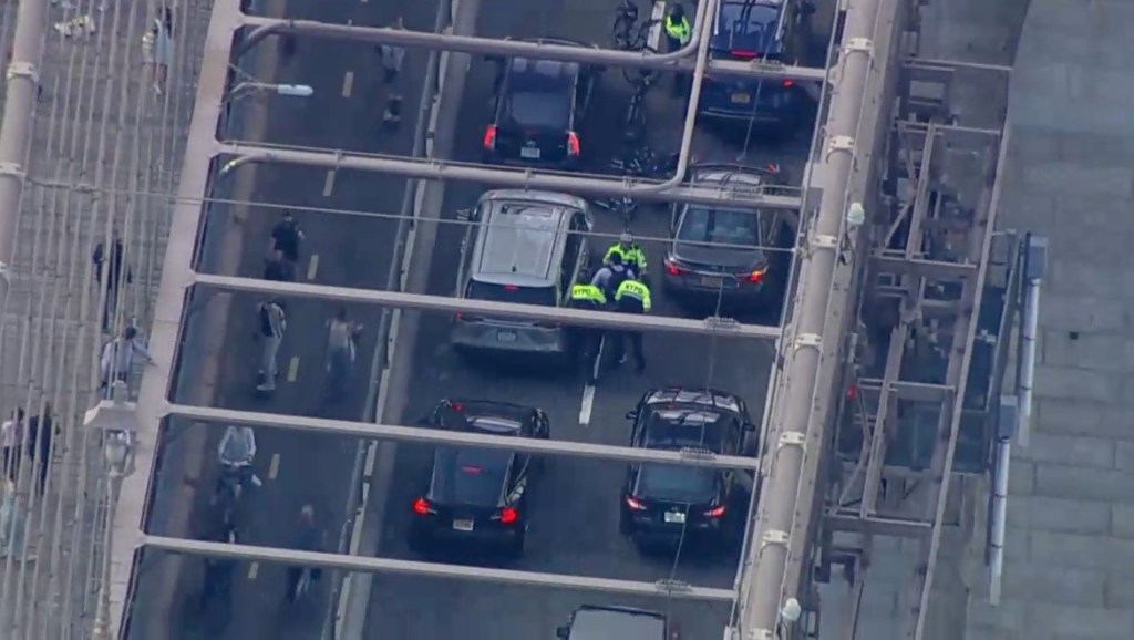 Pro-Palestinian protestors trying to take control of the Manhattan bound Brooklyn Bridge, with presence of police officers in traffic, on Monday, April 15, 2024