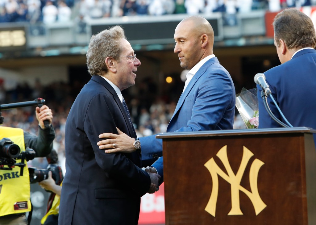 John Sterling and Derek Jeter share a moment during his number retirement in 2017.